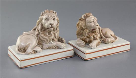 A pair of Wood & Caldwell pearlware models of recumbent lions, c.1800, l. 12.5cm, slight damage